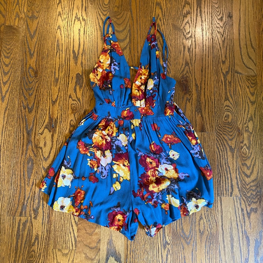 Super cute blue floral open back romper